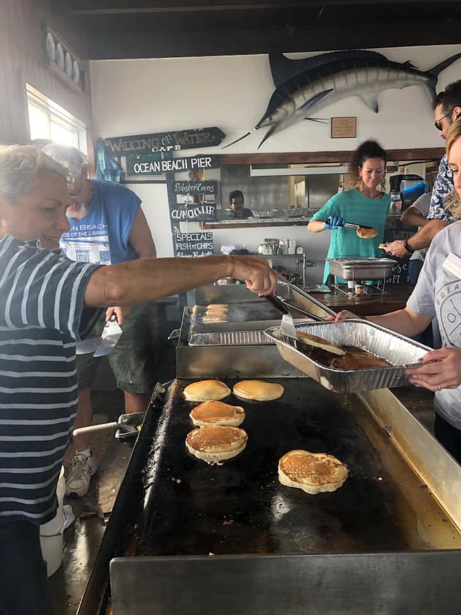 Jen Campbell flipped flapjacks at the OB Pier Pancake Breakfast, but she refused residents’ requests to walk along the OB Wall to see their health and safety concerns first hand.