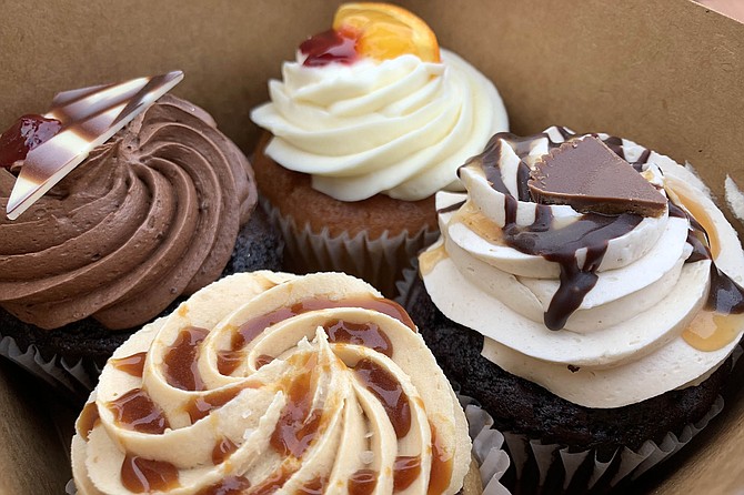 A box of cupcakes: (clockswise from left) chocolate raspberry, bloody orange, peanut butter, and vegan salted caramel