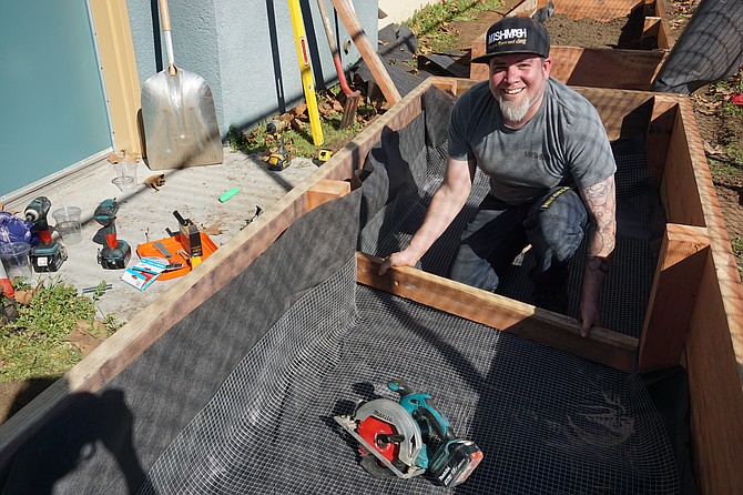 Chef Doug Cook from MishMash restaurant spent the day building garden boxes