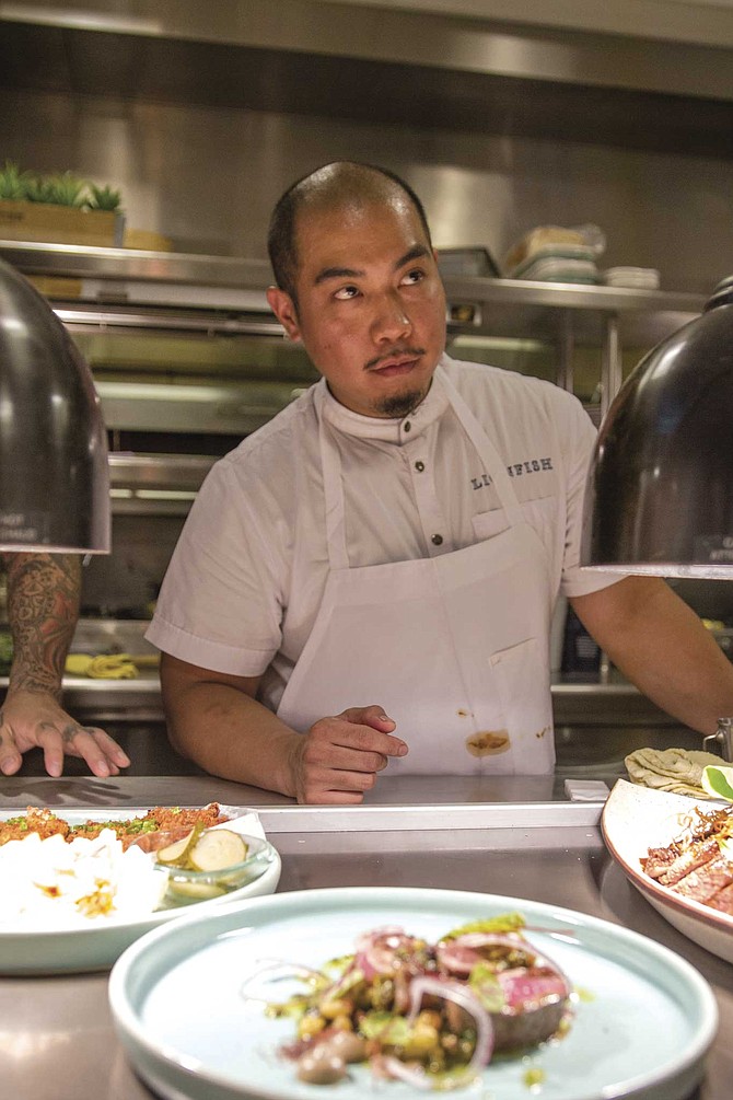Ruiz and his chef de cuisine, Aaron Panganiban (pictured), have been going over recipes with their team, stepping from one station to the next, cooking and plating a single dish at a time.