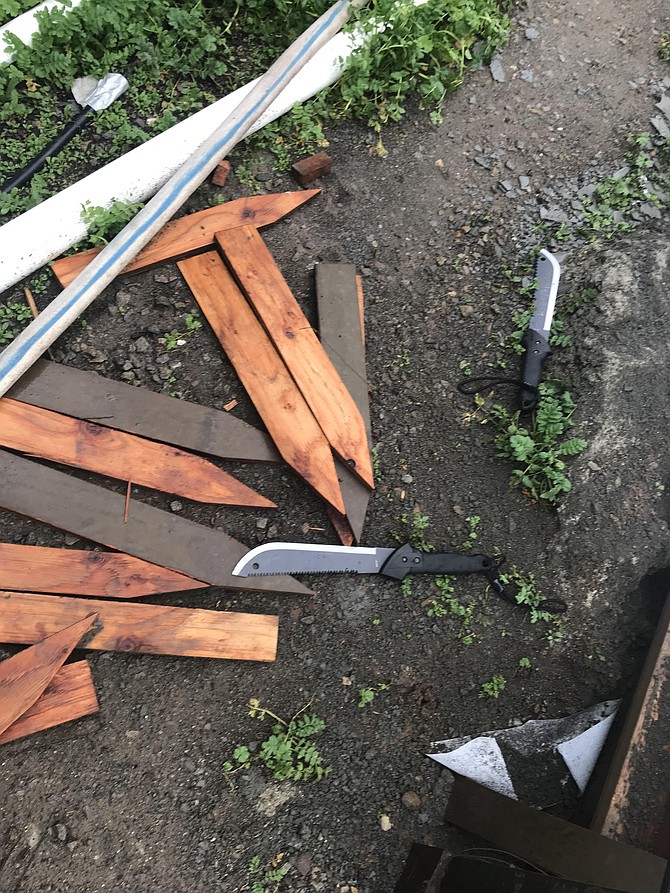 Deputies say the suspect tossed two machetes over a construction fence.