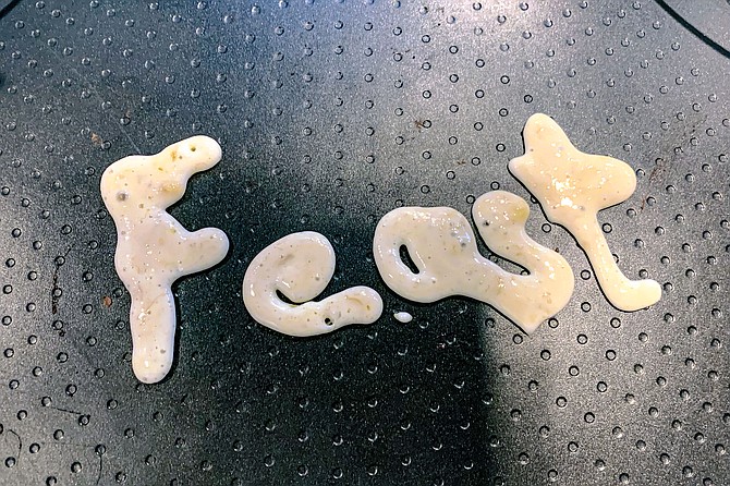 Use a squeeze bottle of pancake batter to write words or create edible illustrations.