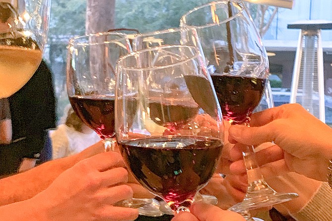 Clinking wine glasses is the new handshake.