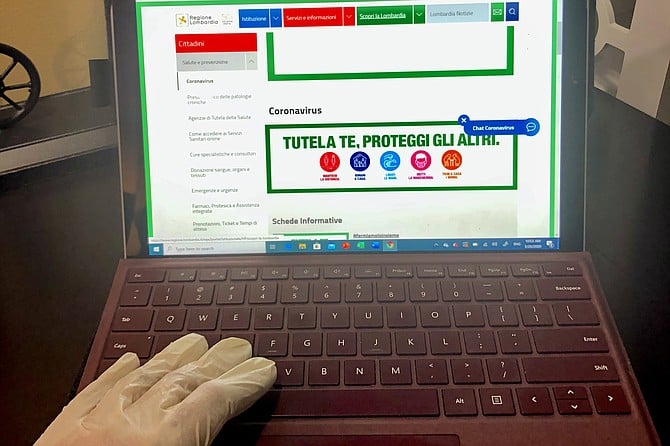In Italy now, even laptops get the gloved-hand approach