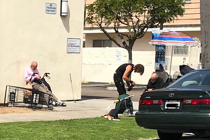 Homeless anarchists congregating together on a public sidewalk encampment in Hillcrest in violation of the state of emergency.