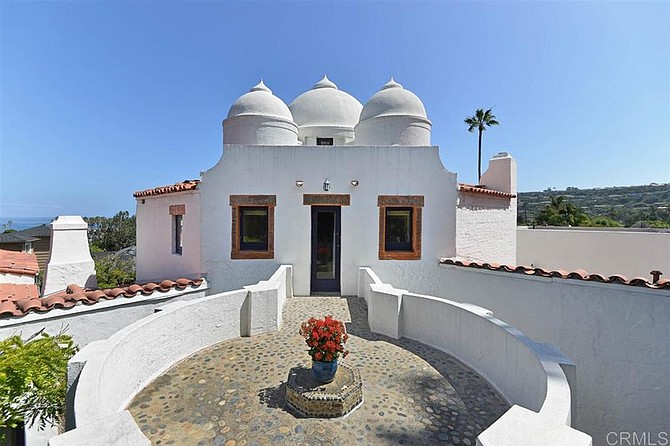 Enjoy “unique Indian vernacular architecture with Spanish Eclectic influences” in this La Jolla landmark residence.