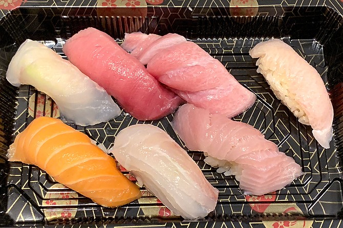 Chef’s selection nigiri from Azuki Sushi, including chutoro fatty tuna, otoro fatty tuns, yellowtail belly, sea bream, king salmon, and halibut.