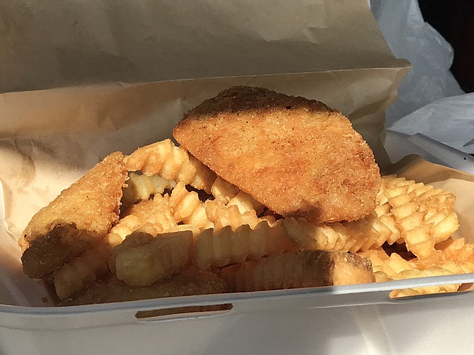 Fish and chips. Four pieces and lots of crinkle cuts = enough for two