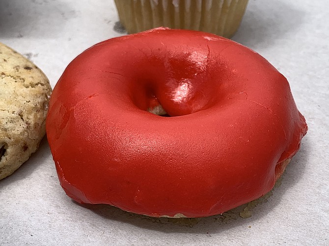 A gluten-free strawberry vanilla glazed donut