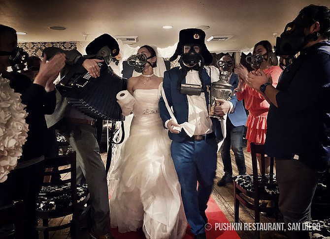 Ike and Yulia Gazaryan's March 13 wedding renewal, held in vintage gasmasks at Pushkin Restaurant. - Image by Photo courtesy of Ike Gazaryan