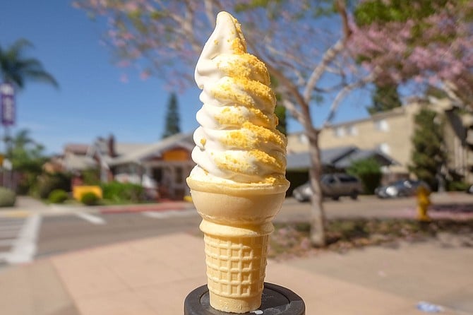A swirl of malted milk and Captain Crunch soft serve ice creams, with crumbled cereal