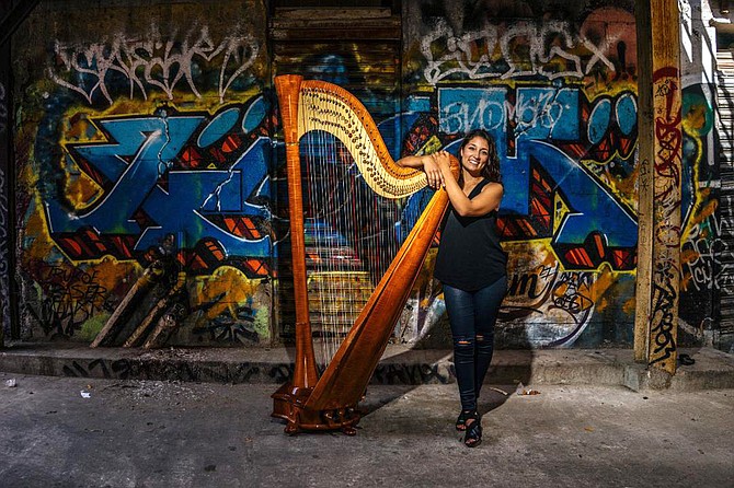 “The harp is six feet tall and weighs about 95 pounds.”