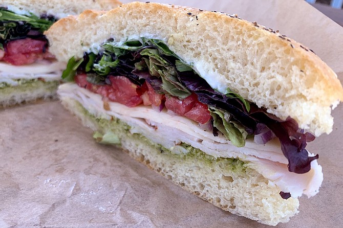 A turkey pesto sandwich on house baked focaccia, from Influx Cafe