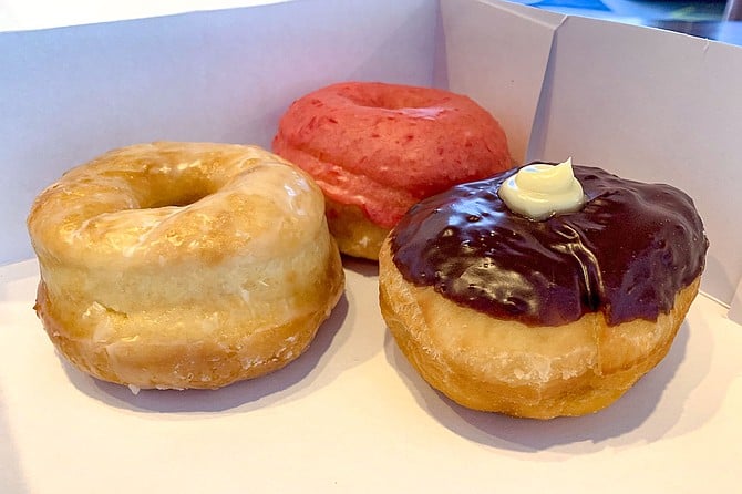 A trio of Solomon's donuts, including Bavarian cream and cherry glazed