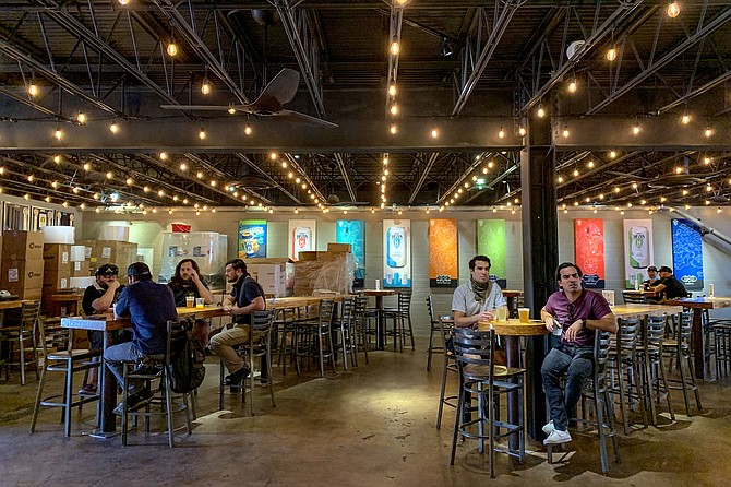Shortly after noon on May 21, socially distanced patrons returned to the Mike Hess brewery in North Park for the first time since the statewide shutdown went into effect on March 17.