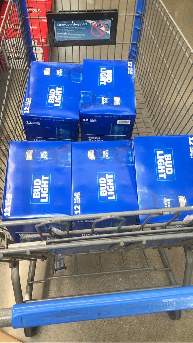 samuel's photo of beer shopping at Walmart in San Diego (shopping cart ad is in English)