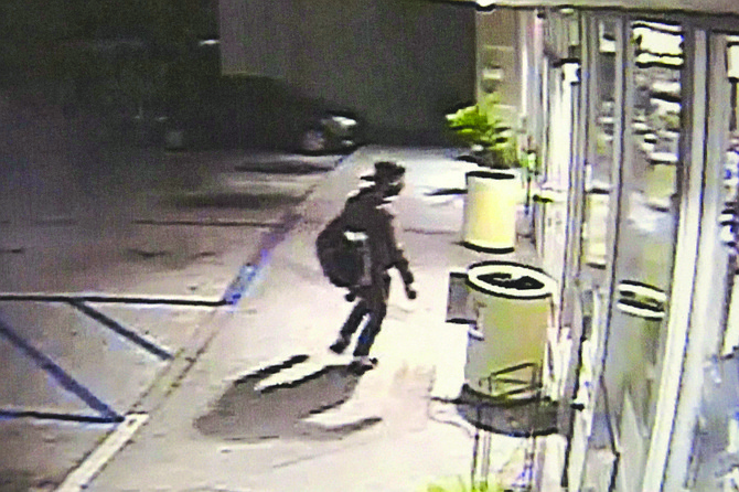 Surveillance photo from the AM/PM on Tamarack in Carlsbad shows a man with a backpack.