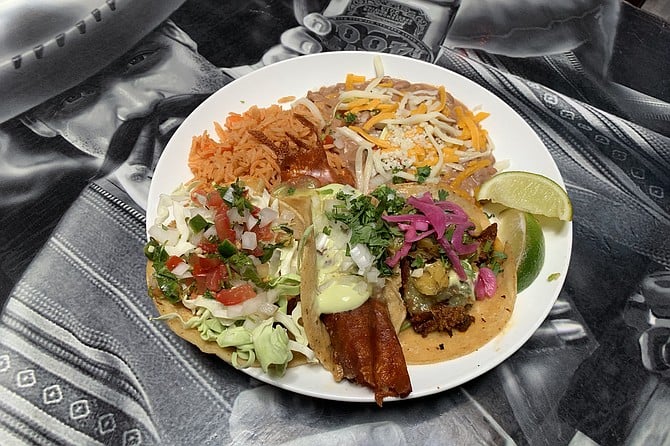 El Chingon taco plate: beans and rice with baja fish, al pastor, and carne asada with fried cheese tacos