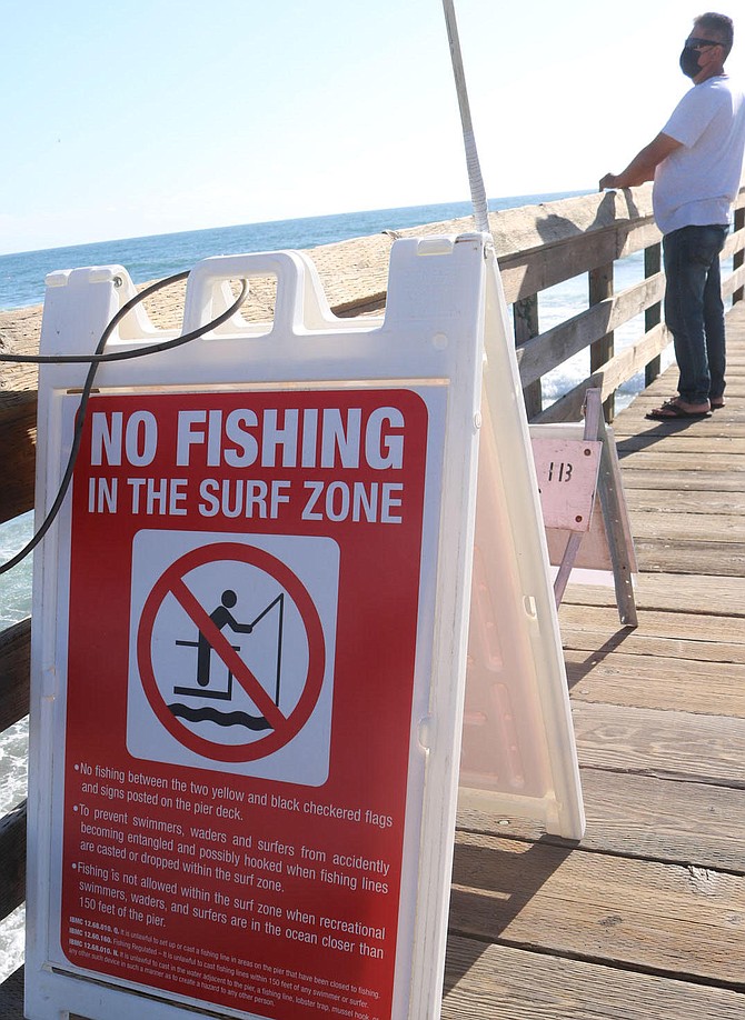 "The surfers are not even supposed to be within 20 feet of the pier, yet we can’t fish there.”