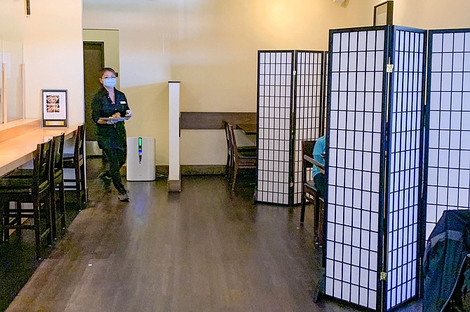 Shoji screens help separate tables, but reduce seating capacity.