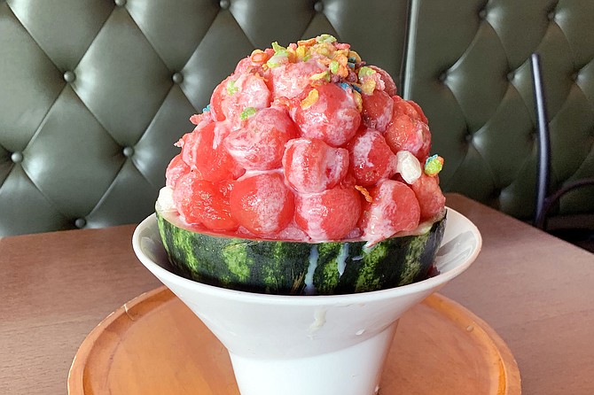 Watermelon bingsoo, with shave ice, condensed milk, and candy toppings