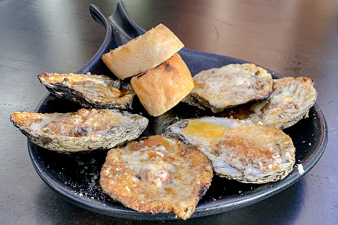 Chargrilled oysters, with garlic, butter, and parmesan