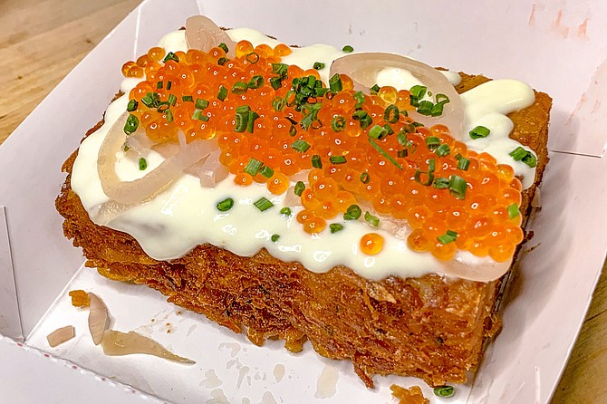 McDonalds hash browns inspired this potato pancake embellished with smoked trout roe.