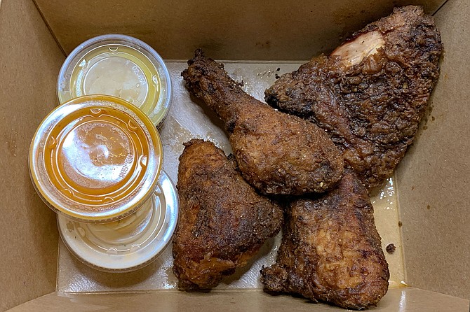 A plain cardboard box of fried chicken, not quite the Colonel's recipe