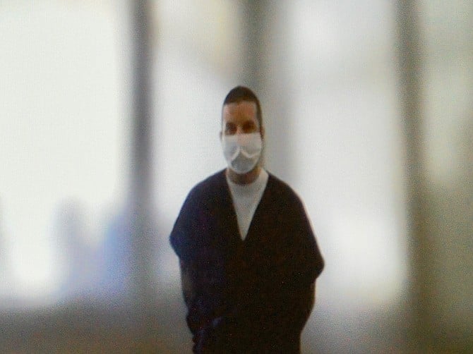 Jay Terry wearing his COVID mask, in custody.  Photo by Eva Knott.