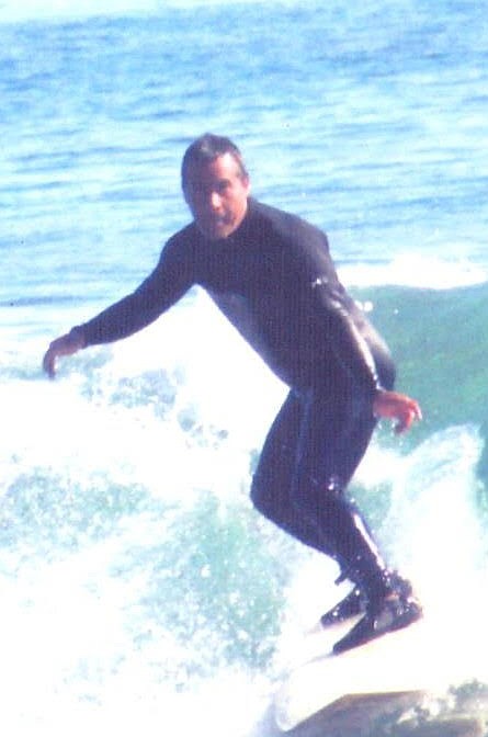 Jacinto Garcia in the water. Downtown Rosarito is open for surfing from 6 am to 10 am.