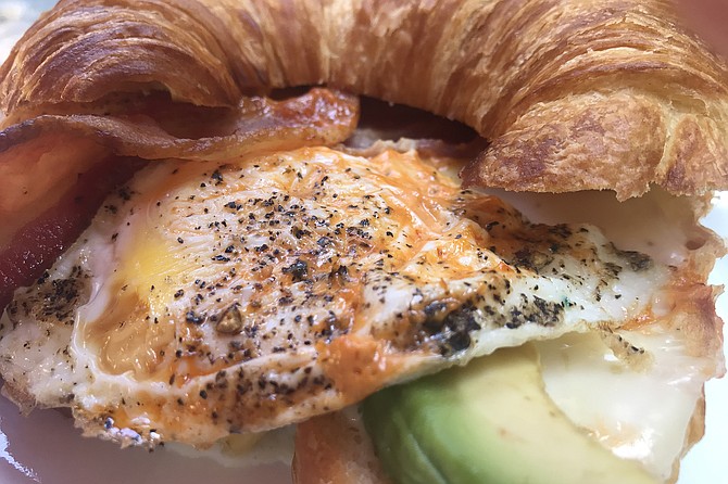 Perfect match: croissant, eggs, avo, bacon.