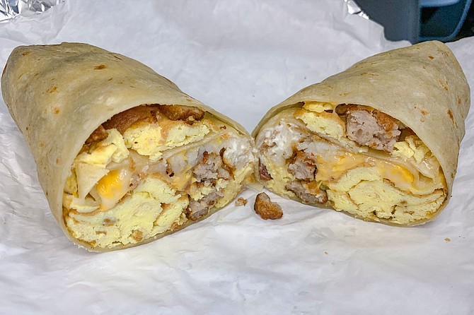 The hash brown breakfast burrito: eggs and cheese with hash browns, sour cream. and sausage.