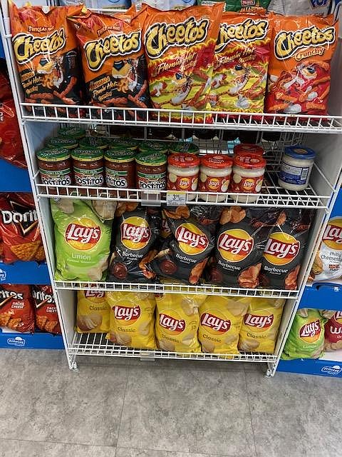 Recalled Frito Lay BBQ chips on freestanding display.