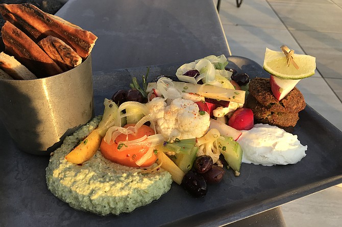 My California mezze plate: whipped goat cheese, lemon hummus, falafel add flavors.