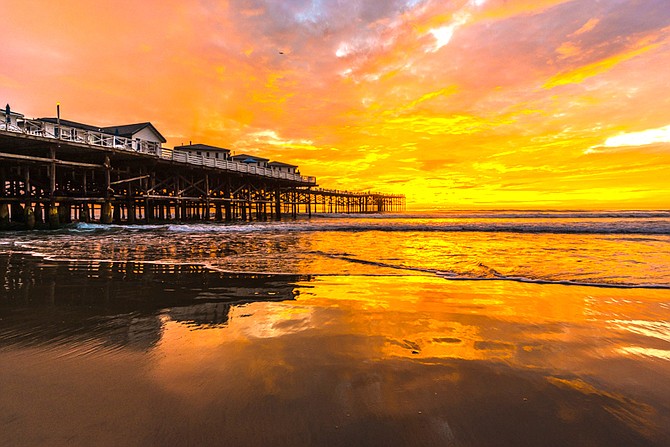 Crystal Pier, Pacific Beach. From the latitude of San Diego, the sun is now setting about 75 seconds earlier every day. - Image by Bonmarito