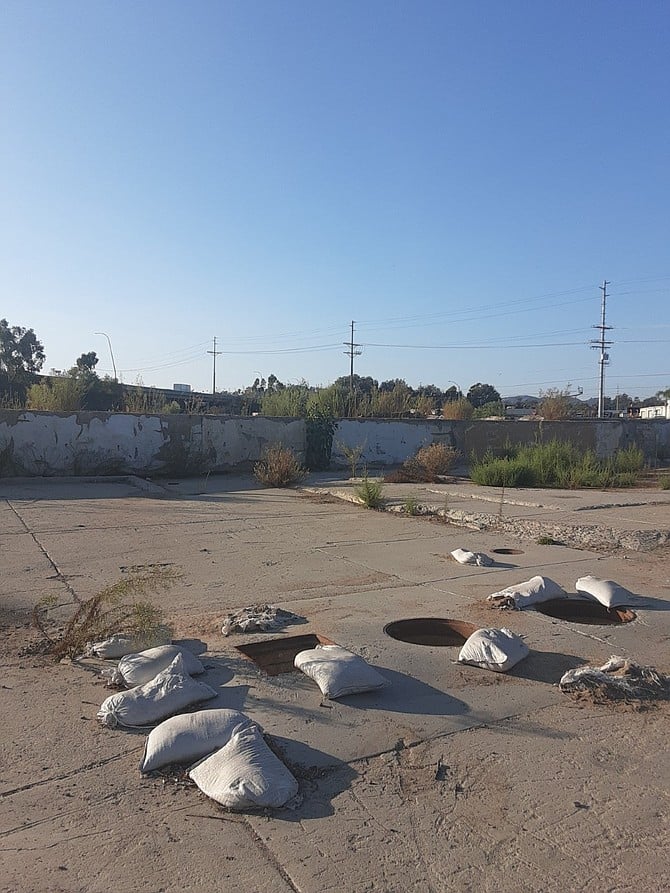 Dirt and sandbags cover what used to be Talone Meat Packing Company