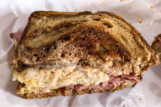 A pastrami sandwich made at butcher shop The Wise Ox