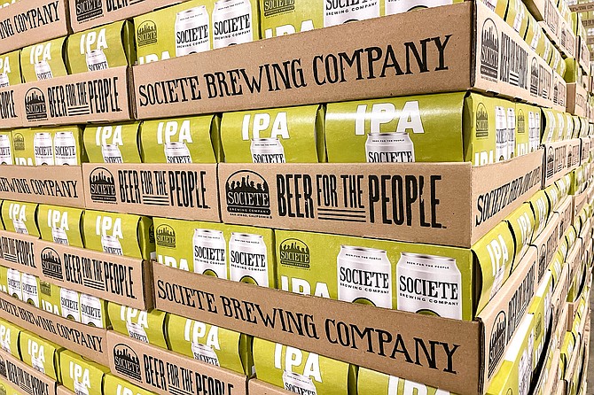 A palette of cans of The Pupil IPA ready to ship from Societe Brewing Company