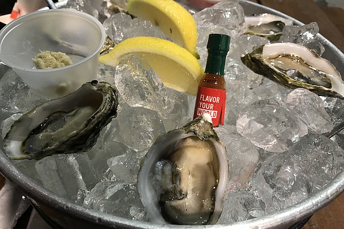 My oysters, with horseradish, Tabasco sauce, lemon, and hot sauce.