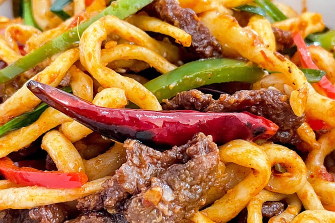 Spicy beef laghman noodles: hand-pulled wheat noodles with mild and spicy peppers