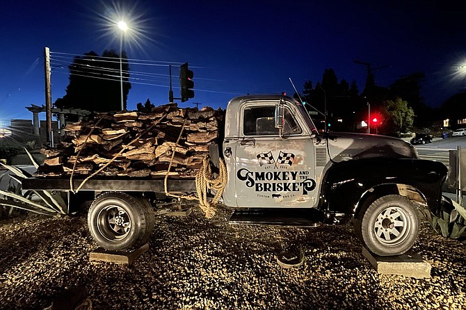A vintage pickup truck stores wood for the smokers on La Mesa's newest BBQ joint.