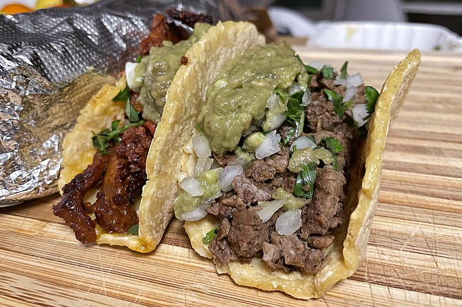 A tri-tip taco and al pastor taco, on thick, handmade tortillas, from Crack Taco Shop in Mission Valley