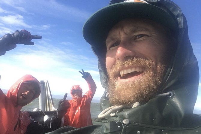 Justin Martin with fellow crew, off Alaska.