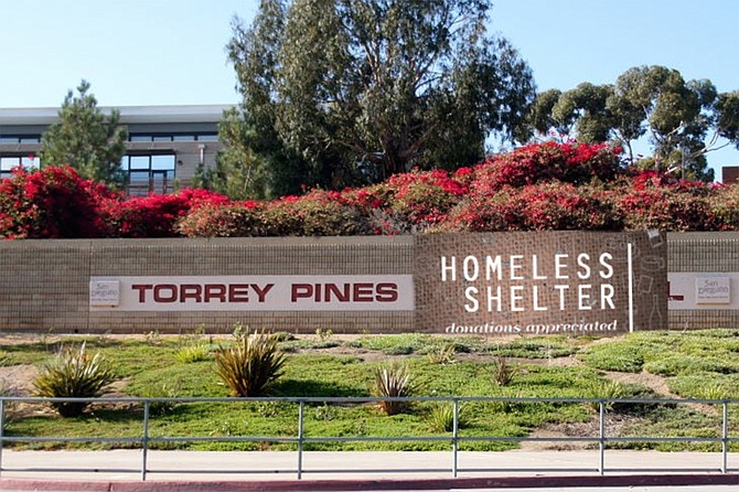 A banner indicates Torrey Pines High School’s new status. Gloria: “Some of these facilities are really first rate. And the teachers didn’t want to go back to in-person instruction, anyway.”