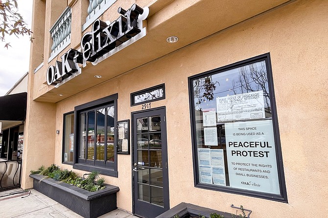 Carlsbad Village restaurant Oak + Elixir has posted a "peaceful protest" notice while remaining open to diners.