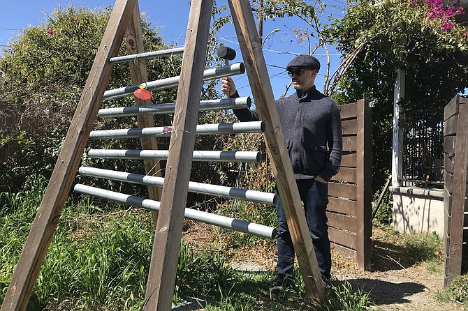 Victor Minces plays his base xylophone.