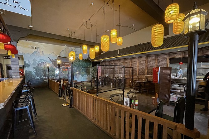 This Dumpling Inn dining room is made to look like the outdoors.