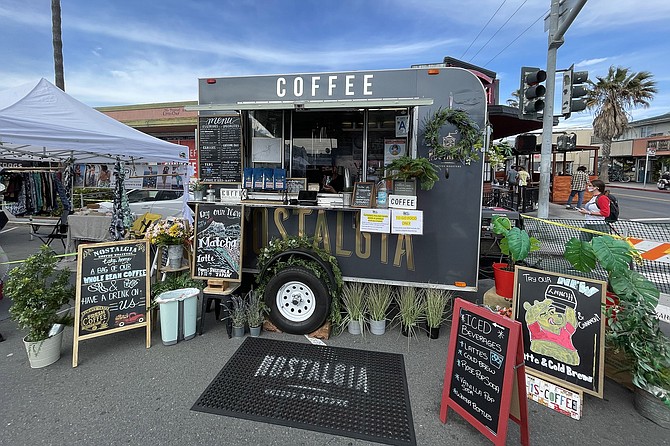 The nostalgia Coffee Roasters coffee cart set up to serve at the Ocean Beach Farmers Market