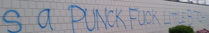Along the side of the Sherwin-Williams paint building “Rodney is a punck fuck little bitch” appeared for the first time.