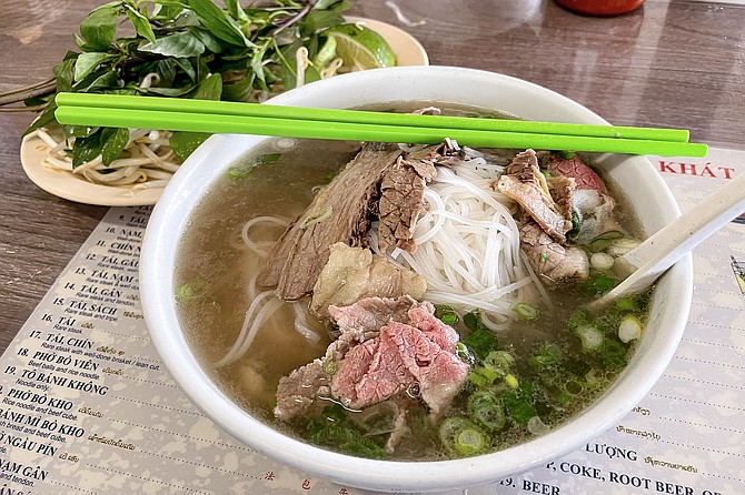 The number 12: beef pho with rare steak and fatty brisket
